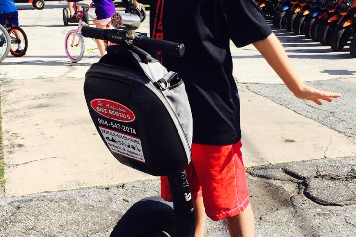 a person riding on the back of a motorcycle
