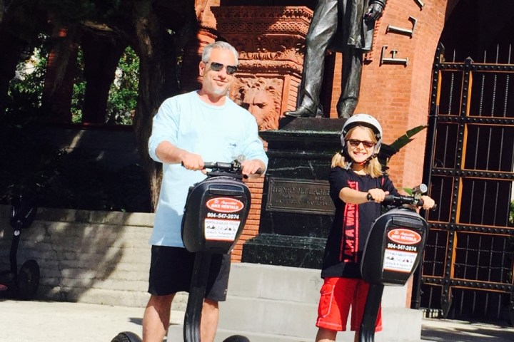 a person riding on the back of a truck