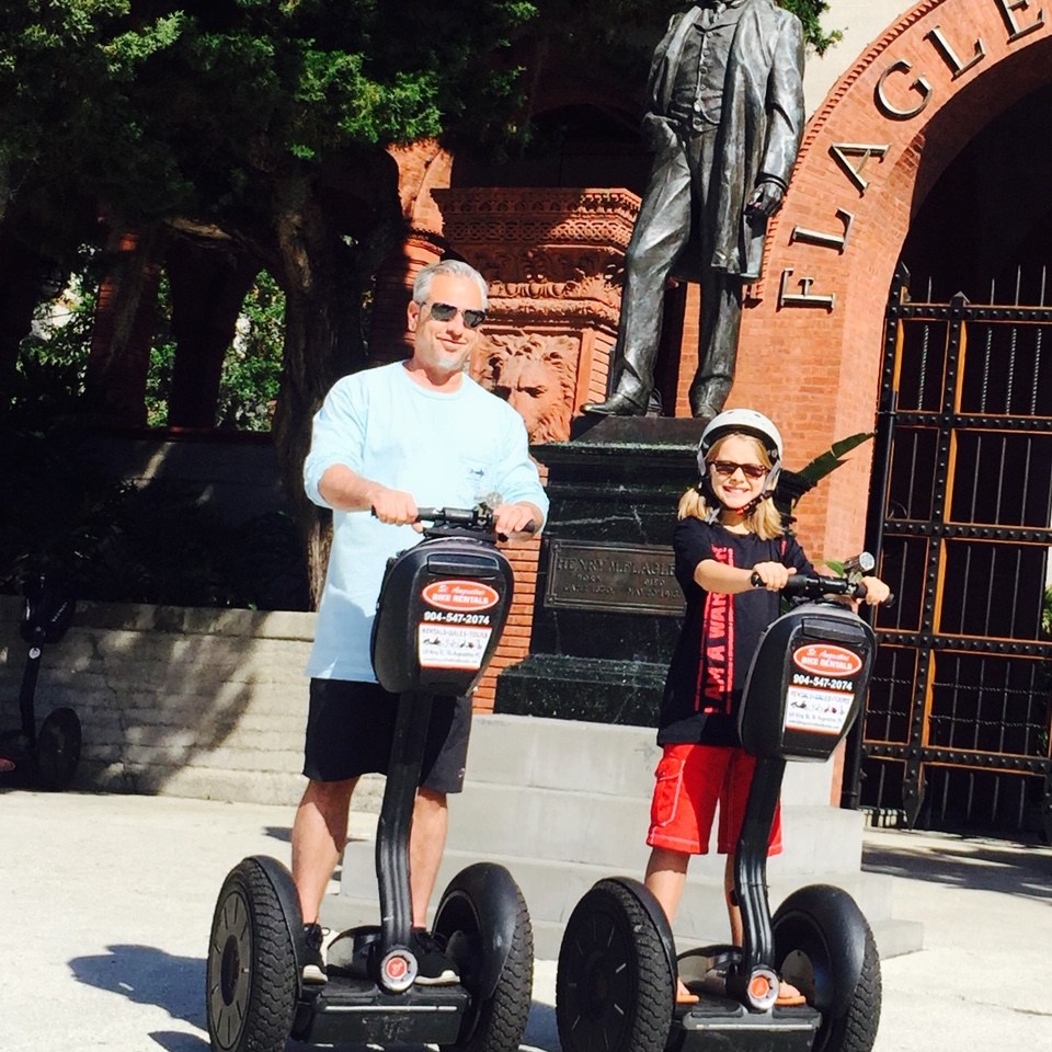a person riding on the back of a truck