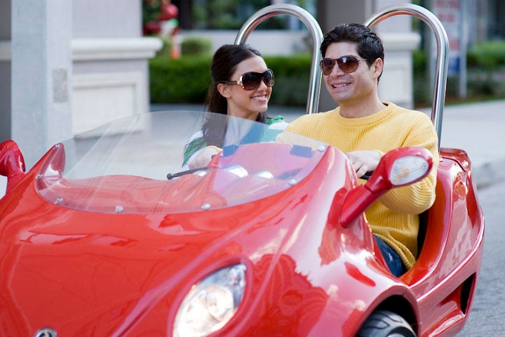 a woman in a red car