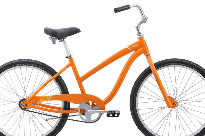a bicycle leaning against a wall