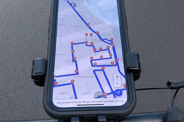 GPS guided tour on e-bike handlebar displaying a map with marked locations.